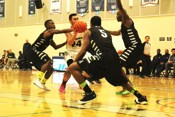 Three players from the Algonquin Thunder try to stop George Brown player Vadim Halimov who is 15 points away from breaking the OCAA all-time scoring record. Feb. 8, 2014 Alex Barbier Gym, George Brown College. Photo: Brittany Barber/The Dialog