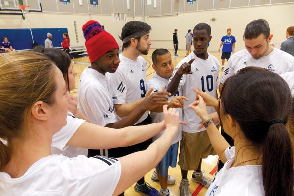 GBC dodgeball players huddle and psych themselves up before a game. Photo: Alena Khabibullina/The Dialog
