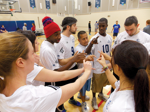 GBC dodgeball players huddle and psych themselves up before a game. Photo: Alena Khabibullina/The Dialog