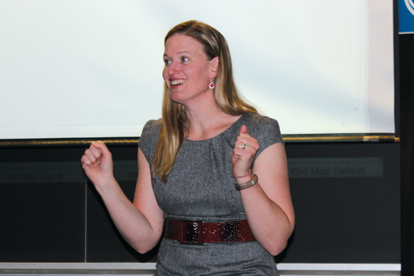 Three-time Olympic hockey medalist Sami-Jo Small enthusiastically telling stories of teamwork on the rink. Photo: Brittany Barber/The Dialog