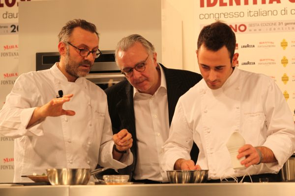 Chef Alain Ducasse (middle) working with two chefs Photo: Alain Ducasse by Leoboudv/Wikimedia Commons. CC SA 2.0