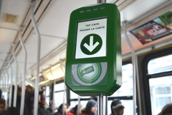 Image of a Presto card reader on a poll in a street car
