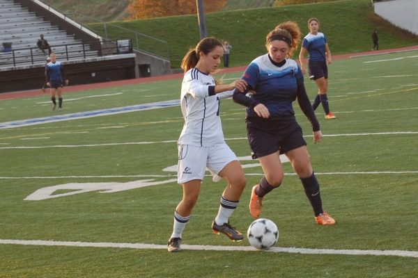 George Brown Huskies centre midfielder Effie Takas dribbles the ball