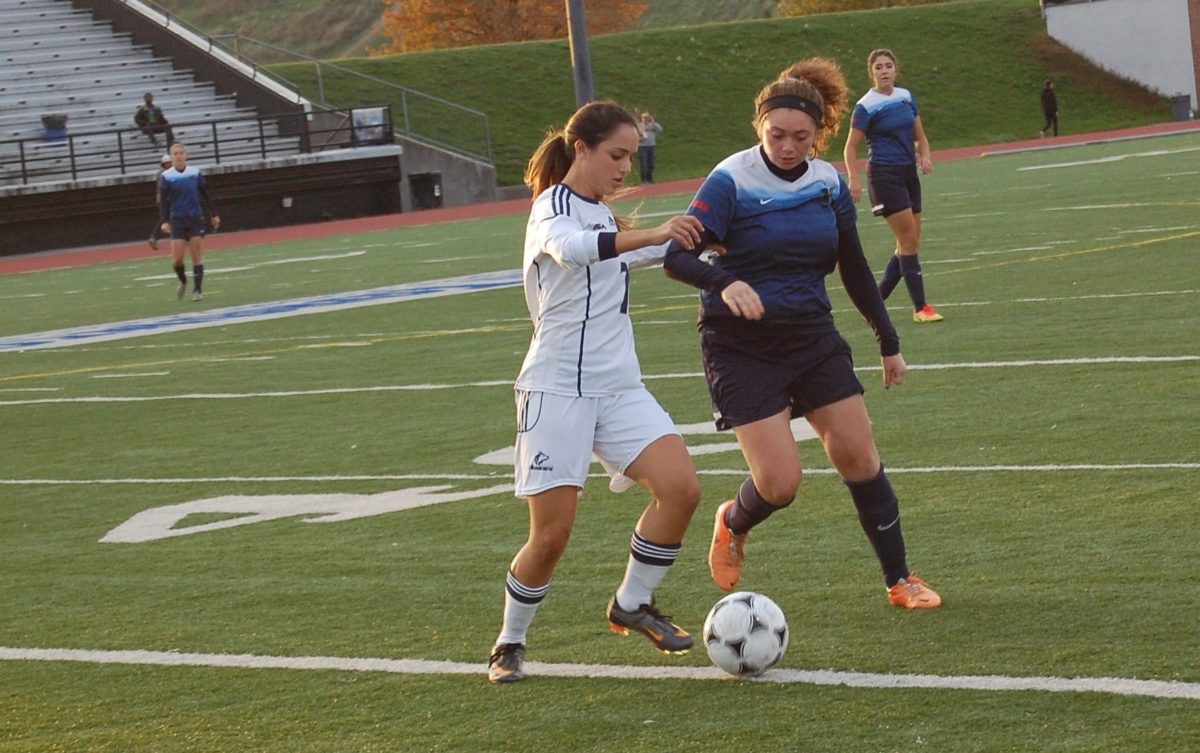 George Brown Huskies centre midfielder Effie Takas dribbles the ball