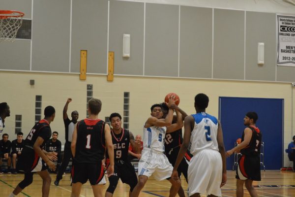 GBC men's basketball forward Adam Costanzo, #9 in centre, is among the Huskies leaders in points-per-game and is seen here battling for the ball in the Nov. 10 game against St. Lawrence College. Photo: Allison Preston / The Dialog