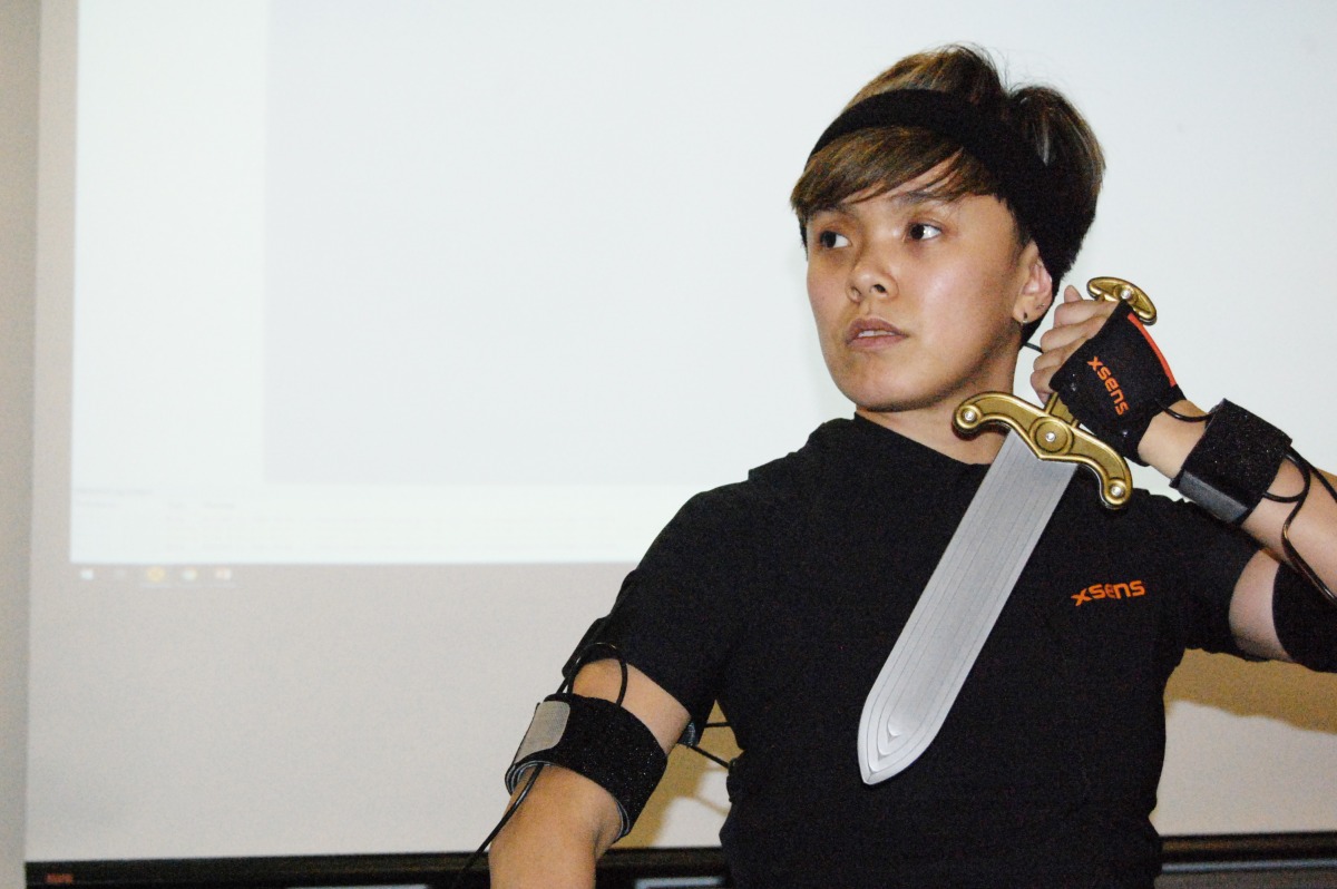 Thi Uyen My Nguyen, a Game Arts student at George Brown College, suits up in a XSENS motion capture suit at the School of Design. Photo: Leslie Gallagher / The Dialog