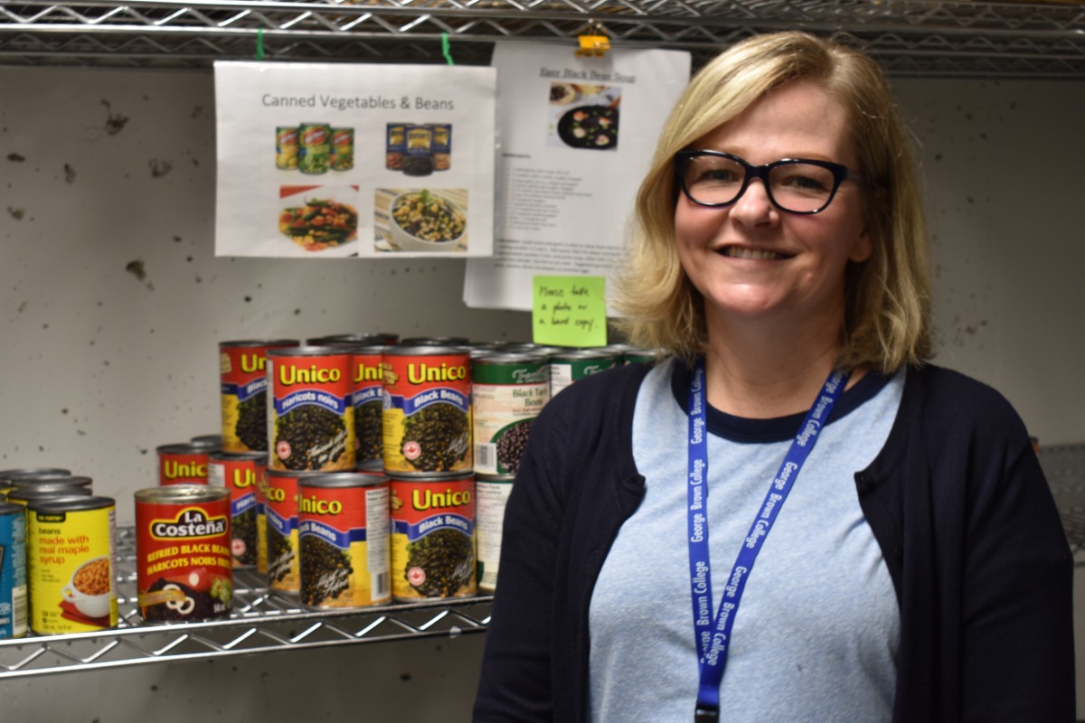 Darcy Mallany works at the Student Association food bank at George Brown College, which has seen a 67 per cent increase in visits since 2017. Photo: Luiz Felipe Lamussi / The Dialog